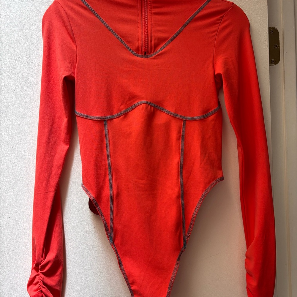 Orange and teal stitch Long Sleeve Bodysuit